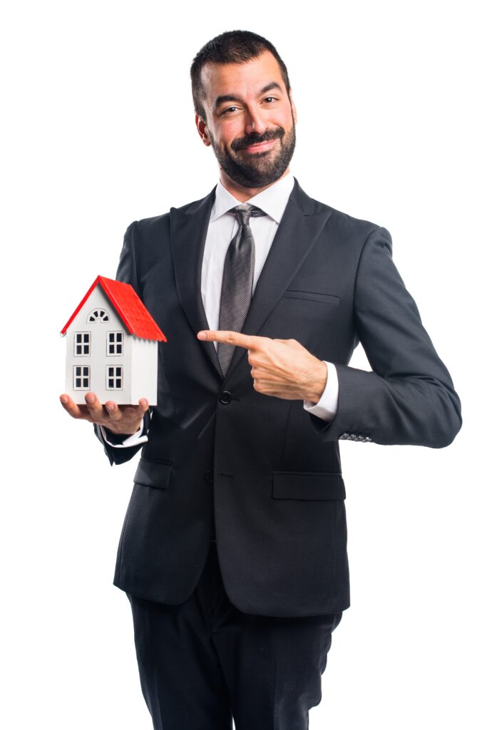 Businessman holding a little house empresario sosteniendo una pequena casa
